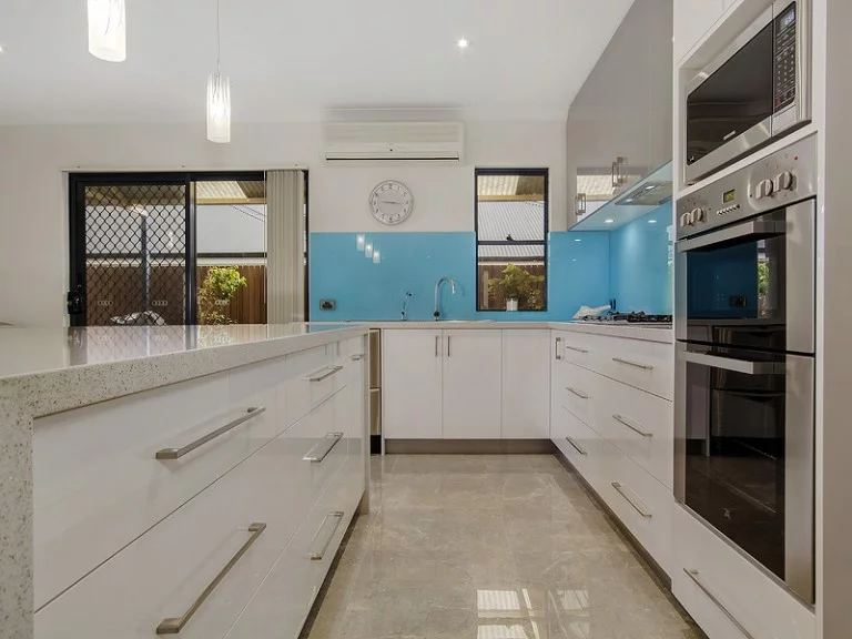 Kitchen with glass splashback